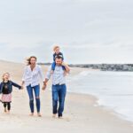 family walks hand in hand during LBI nj family candid photos