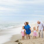 grandparents with two grandaughters on beach LBI