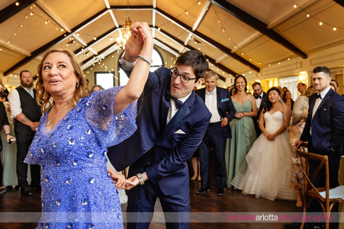 groom dances with mother Lake Mohawk Country Club spring lakeside wedding reception NJ