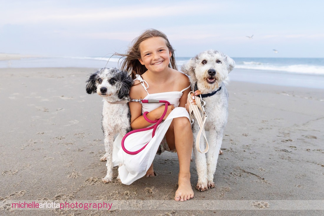 Harvey Cedars LBI New Jersey little girl with two dogs on the beach during family portraits