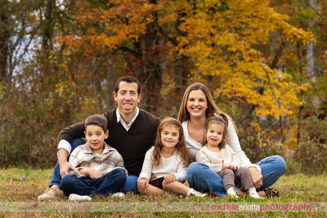 family of five in front of fall foliage in new jersey 