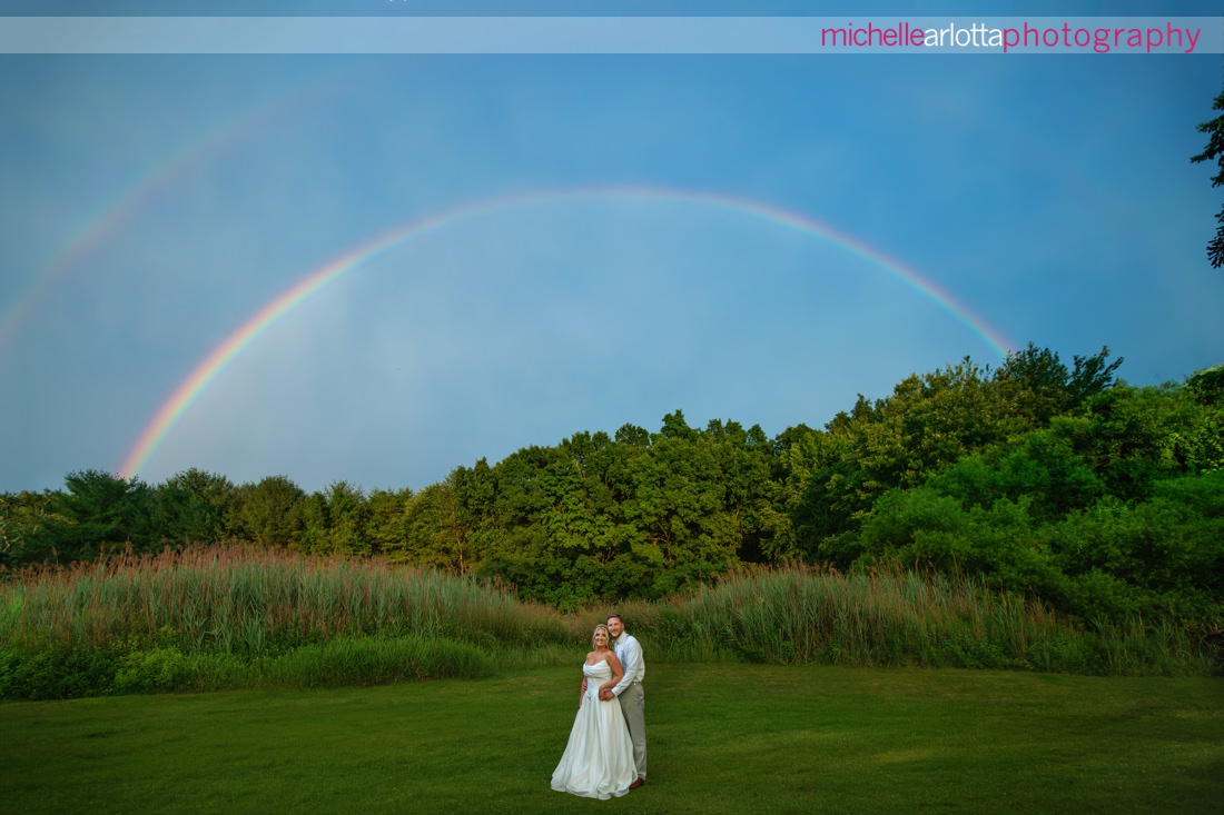 Perona Farms summer wedding NJ bride and groom with double rainbow