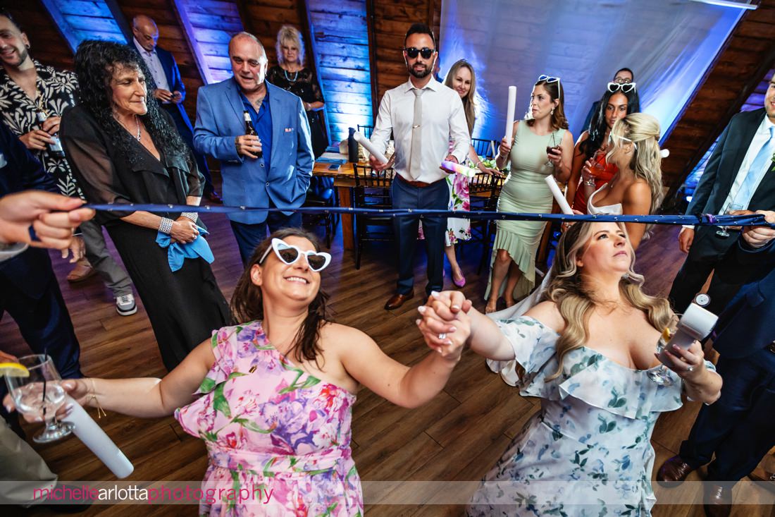 Perona Farms summer wedding reception tie limbo